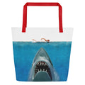 Front view of the Jaws 50th Anniversary beach bag in red with a vibrant two-sided movie graphic
