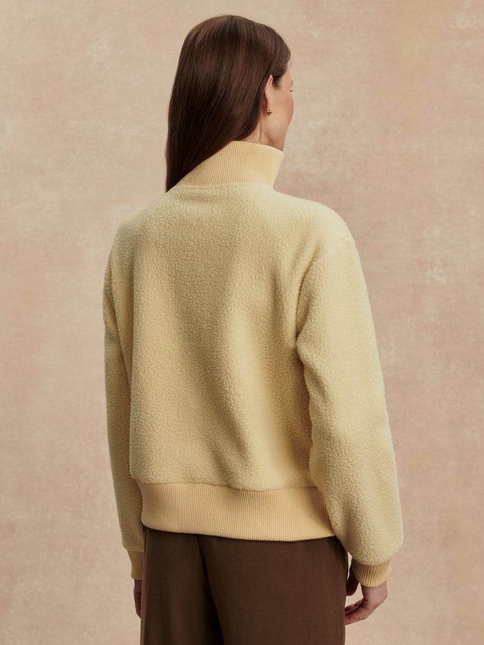 Reed Yellow|Front-facing image of the Jaylin Half Zip Fleece in Reed Yellow, featuring a stand collar and half-zip in soft fleece.