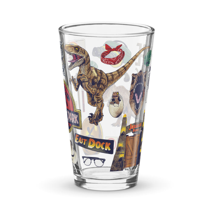 Close-up view of the Jurassic Park logo and dinosaur silhouette artwork on the glass