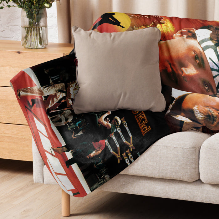 Side angle view of the Karate Kid blanket draped over a living room couch