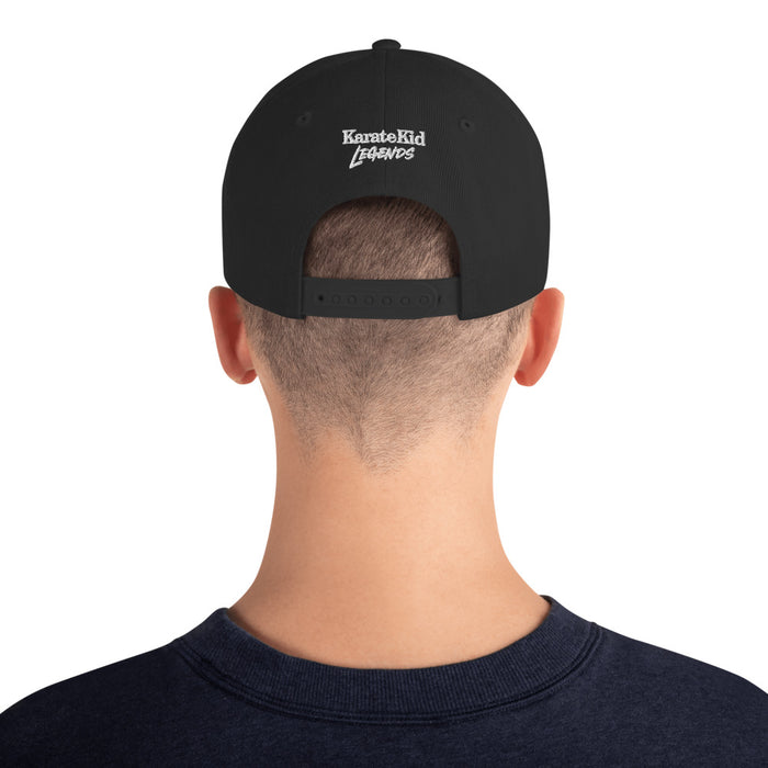 Back view of the black Karate Kid hat highlighting the adjustable snapback strap and structured fit