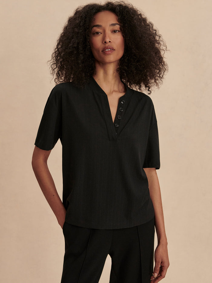 Black|Front view of the Kasey Mock Placket Rib Tee in black, rib-knit fabric with a subtle mock-placket detail.