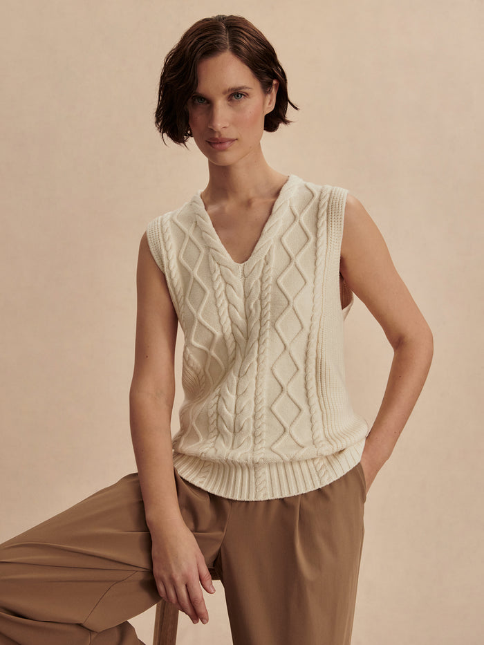 Snow White|Kay Cable Knit Vest in Snow White featuring a chic v-neck, knitted fabric, dropped armholes, and a standard fit for everyday wear.