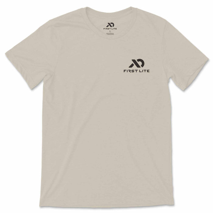 Light tan t-shirt with a black First Lite logo on the left chest.