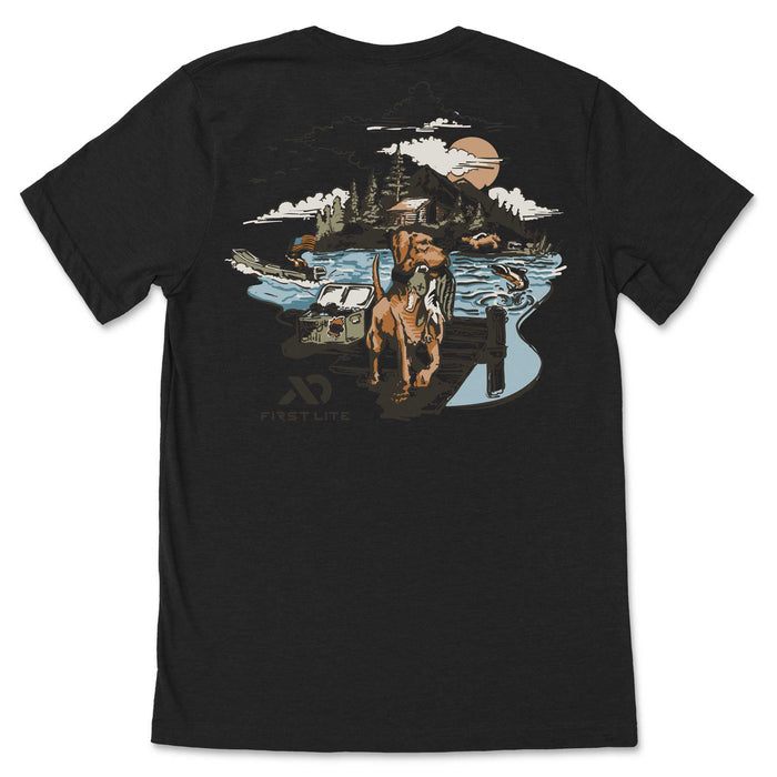 Black t-shirt with a detailed back graphic featuring a retriever dog in water holding a duck, a jeep, a cabin, mountains, a large sun, and the First Lite logo.