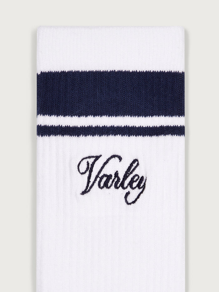 White/ Blue Nights|Varley Lamar Club Stripe Sock in White and Blue Nights, knit crew sock with white base and blue stripes and a logo at the cuff.