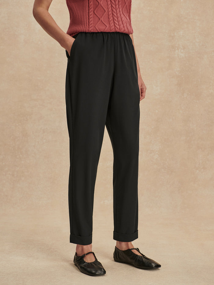 Black|ALANA Slim Tapered Cuff Pant 2.0 in Black, full-length shot highlighting the slim tapered legs and cuffed ankles.