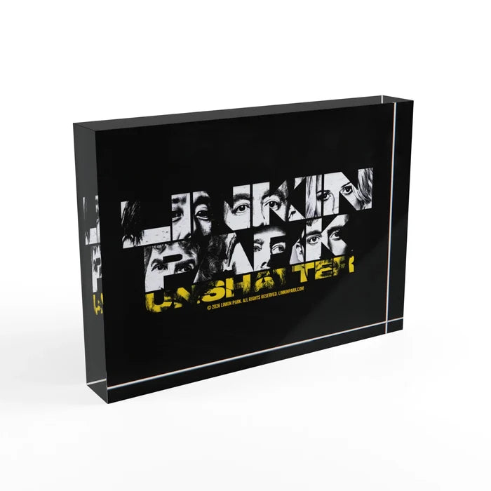 Angled side view of the clear acrylic photo block highlighting its thickness and polished black vinyl backing