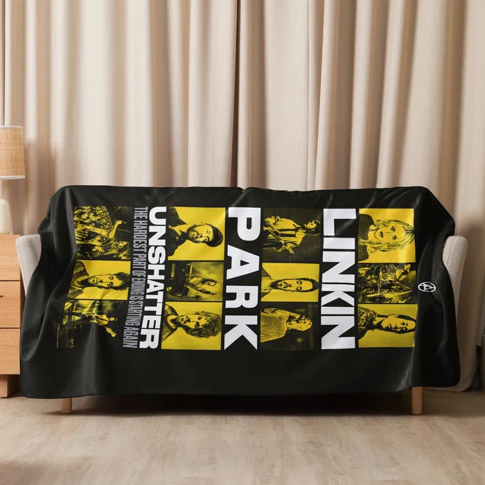 Lifestyle view of the Linkin Park sherpa blanket draped neatly over a couch