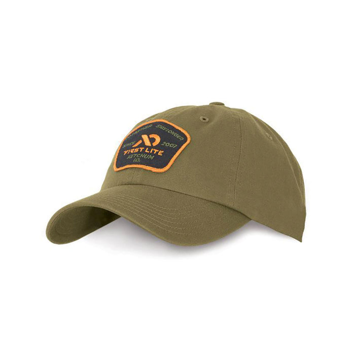 Olive green baseball cap with a dark front patch featuring orange 'FIRST LITE KETCHUM ID.' text and logo.