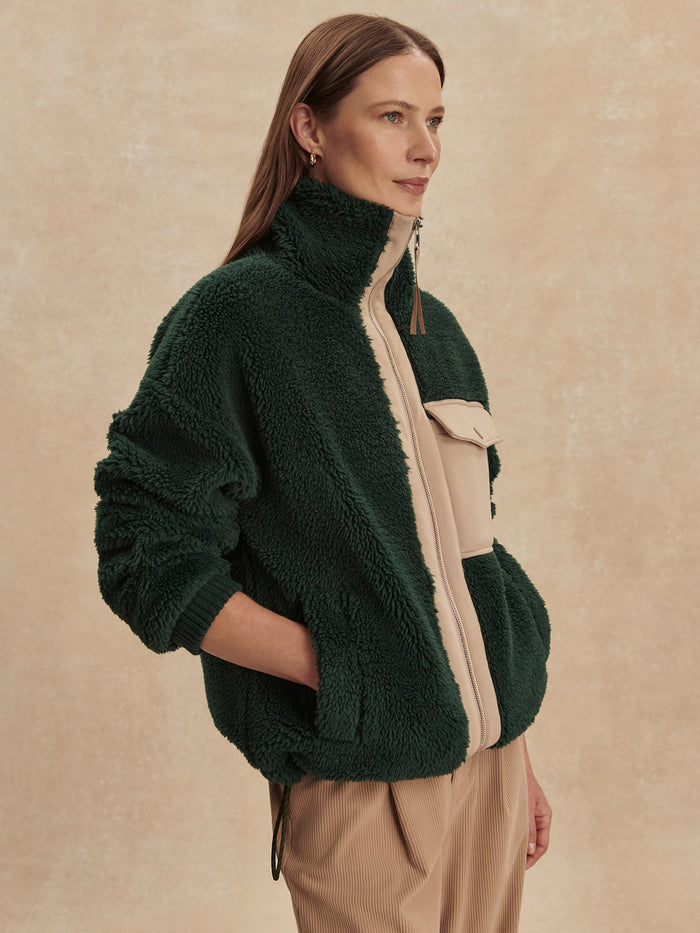 Pine Grove|Front view of the Lowell Sherpa Jacket in Pine Grove green, showcasing a zip-front, stand collar, and plush sherpa fabric.