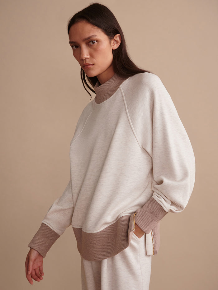 Ivory Marl/ Taupe Marl|Front view of the Loxley Raglan Boyfriend Sweat in Ivory Marl / Taupe Marl, a relaxed two-tone raglan sweatshirt with an oversized fit.
