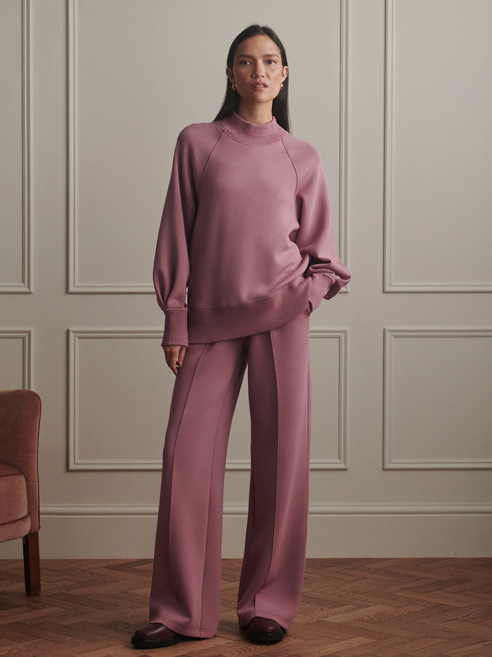 Wistful Mauve|Front view of the Varley Loxley Raglan Boyfriend Sweat in Wistful Mauve, relaxed oversized fit, long sleeves, soft fleece fabric.