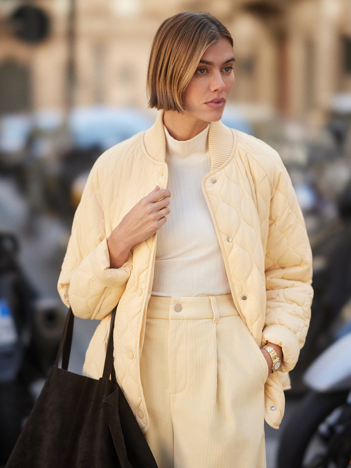 Reed Yellow|Luca Quilted Jacket in Reed Yellow, a contemporary bomber with curved hem, onion-quilt matte nylon, Sorona fill, large pockets, matte enamel snaps.