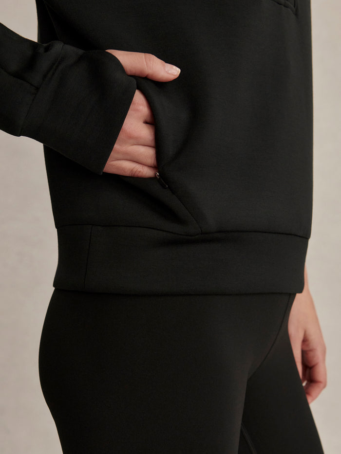 Black|Front view of the Marissa Half Zip Midlayer in Black, a fleece midlayer with a high collar and subtle zip, ideal for layering.