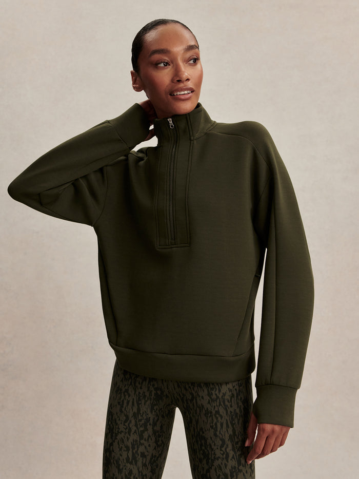 Dark Resin Green|Varley Marissa Half Zip Midlayer in Dark Resin Green, featuring a front half-zip neckline and long sleeves for a streamlined look.
