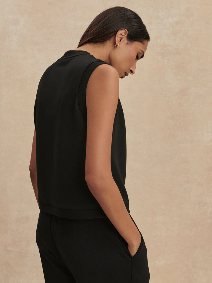 Black|Marla Button Placket Tank in Black, back view with sleeveless silhouette and front button placket detail.