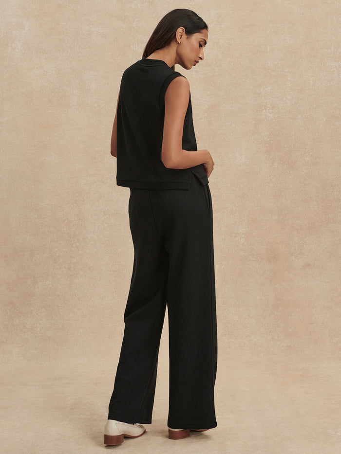 Black|Back view of the Varley Marla Button Placket Tank in Black, a sleeveless top with button-front placket.