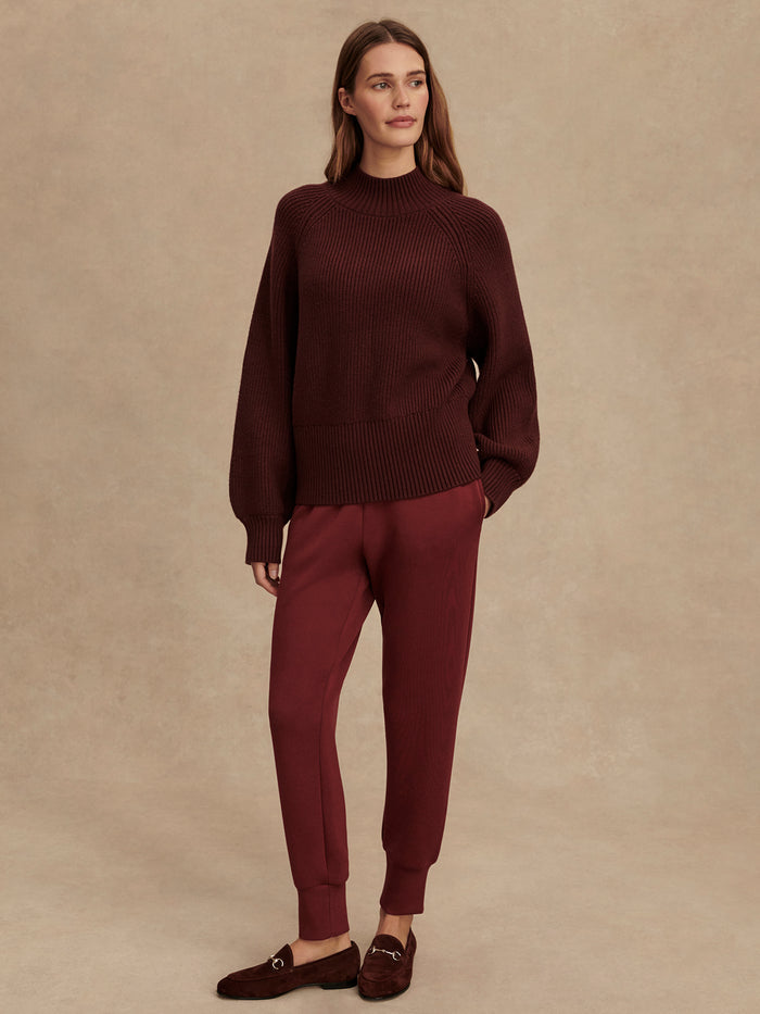 Decadent Chocolate|Martina High Neck Rib Knit in Decadent Chocolate, front view of a chocolate-brown ribbed knit sweater with a high neck and fitted silhouette.