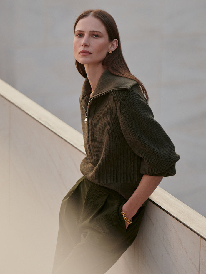Olive Night|Front view of the Maura Half Zip Rib Knit Olive Night with a half-zip collar and ribbed texture.