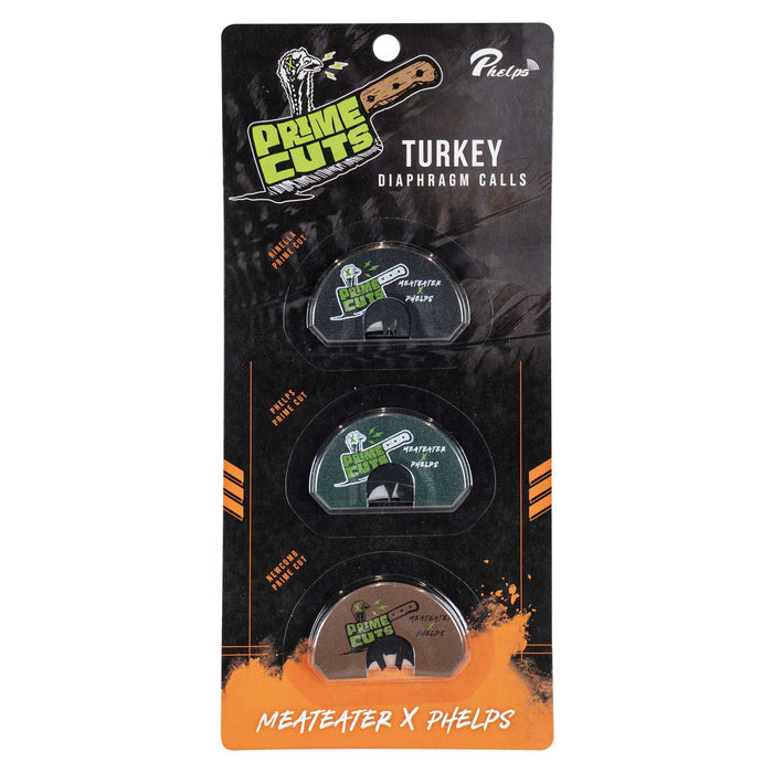 A 3-pack of Phelps Game Calls Prime Cuts Turkey Diaphragm Calls on a black and orange "MeatEater X Phelps" branded package, featuring calls with black, dark green, and brown backgrounds.