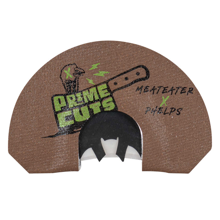 Brown turkey diaphragm call with a black batwing cut reed, featuring "PRIME CUTS," a turkey head, cleaver graphic, and "MEATEATER x PHELPS" text.