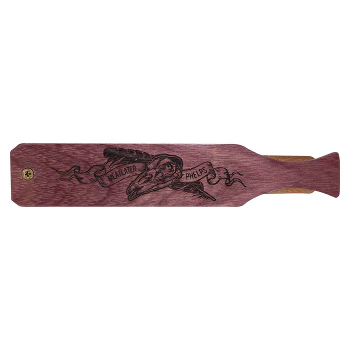 Purpleheart paddle call with engraved 'MEATEATER PHELPS' banner, skull, and feather design.