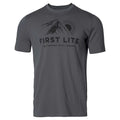 Charcoal grey t-shirt featuring a black graphic of a mountain, sun, airplane, and 'FIRST LITE GO FARTHER. STAY LONGER.' text.