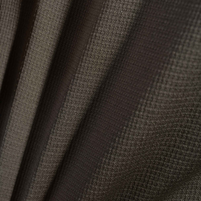 Close-up of grid knit technical athletic fabric.