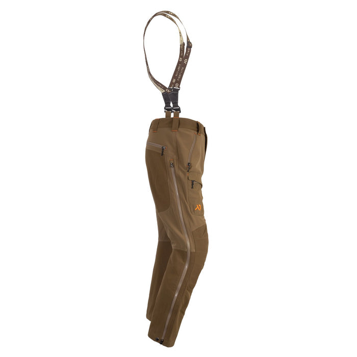 Olive brown technical hunting pants featuring detachable First Lite suspenders, multiple zippered cargo pockets, and full-length side leg zippers.