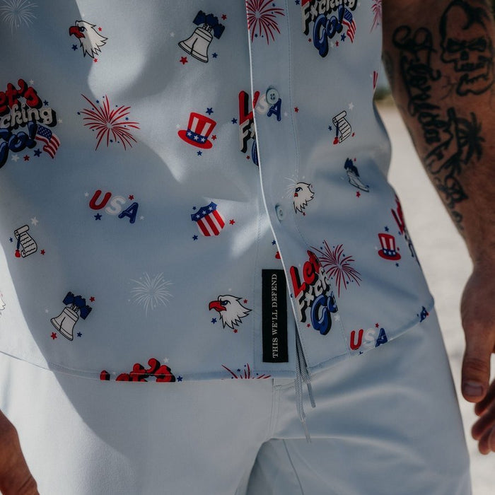 White tank top with red, blue, and black graphics on a white background