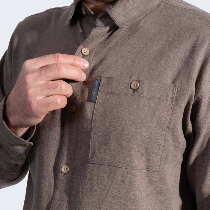Brown button-up shirt with a visible brand label on a white background