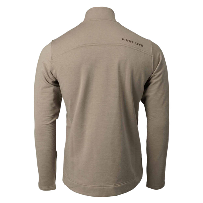 Back view of a tan long-sleeved top with a high collar, 'FIRST LITE' logo on the upper right back, and horizontal seam details.