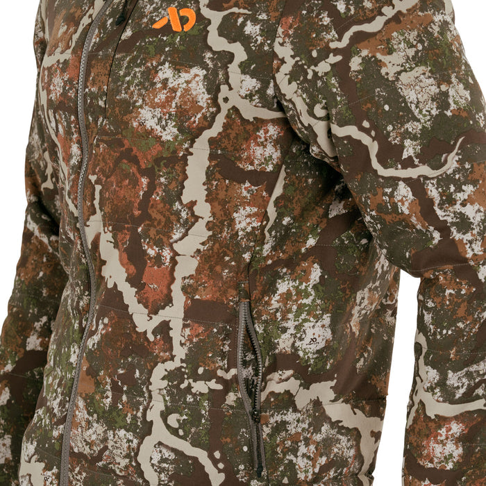 Camouflage jacket with brown, green, orange, and beige patterns, featuring a full gray zipper front, two zippered side pockets, and an orange chest logo.