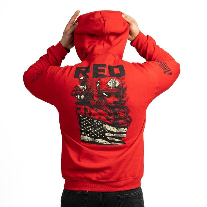 Red hoodie with graphic design on the back, worn by a person against a white background