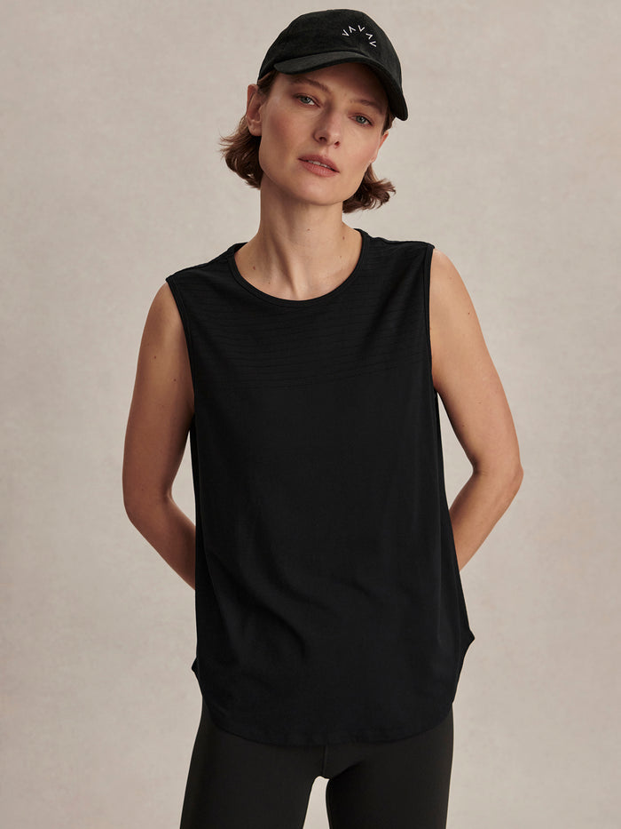 Black|Nolan Seamless Longline Tank in Black, modal seamless fabric with soft drape and textured feel; shaped hem, ideal with active shorts or leggings.