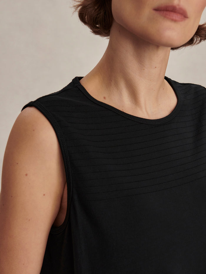 Black|Nolan Seamless Longline Tank in Black, a sleeveless seamless top with extended length for layering.