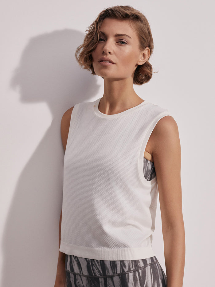 Snow White|Page Seamless Crop Tank in Snow White, cropped silhouette with dropped armholes and subtle perforation in soft Seamless fabric for all-day comfort.
