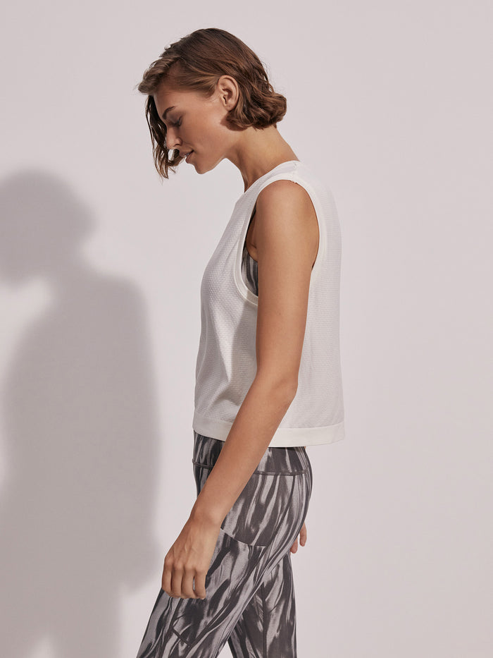 Snow White|Front view of the Varley Seamless Crop Tank Snow White, a sleeveless crop top with seamless knit fabric.