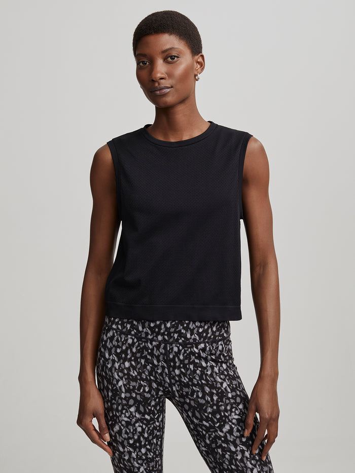 Black|Varley Seamless Crop Tank in Black, a close-fitting sleeveless crop tank with seamless construction.