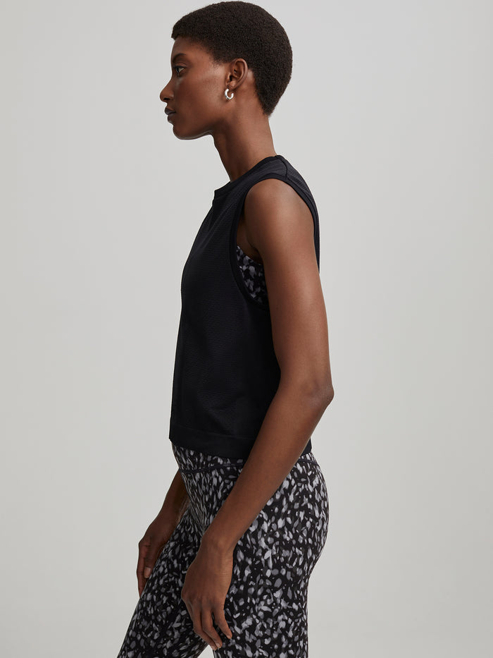 Black|Front view of the Varley Seamless Crop Tank in Black, a seamless cropped sleeveless top designed for comfort and sleek fit.