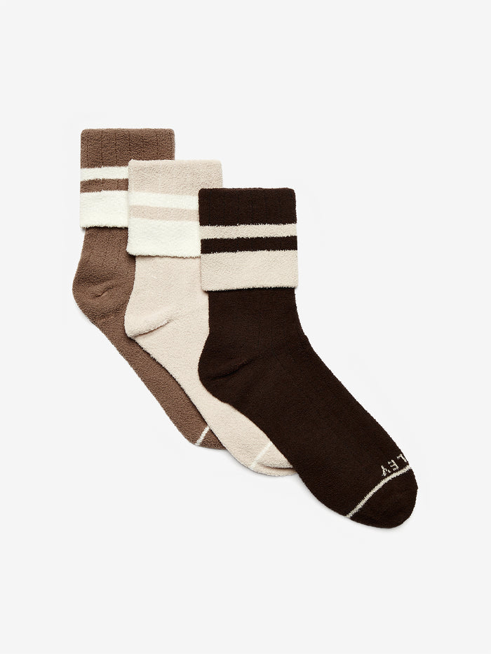 Golden Bronze/ Egret|Preston Sock Group in Egret and Golden Bronze, multiple pairs laid flat, knit texture and ribbed cuffs visible.