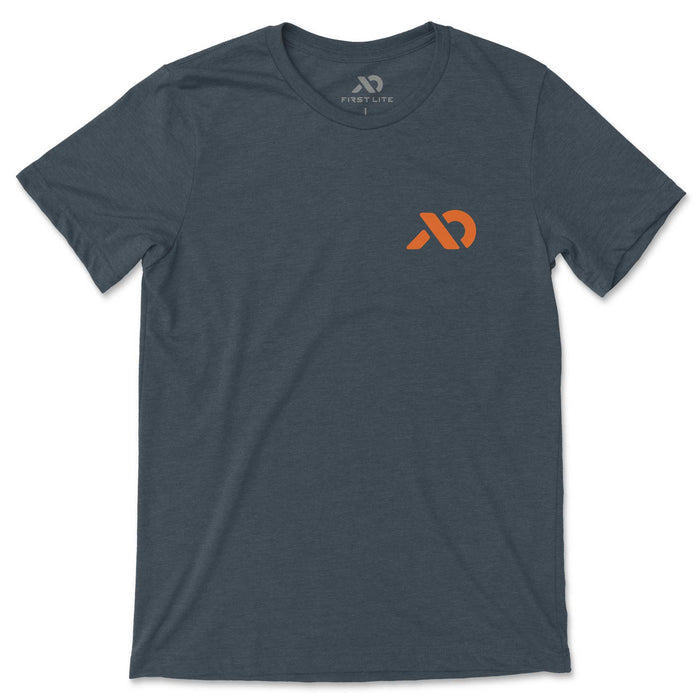 Dark blue-gray t-shirt with an orange First Lite logo on the left chest.