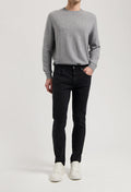 Sustainable MUD Jeans ensemble featuring dark denim shirt and blue jeans, highlighting ethical fashion in classic style.