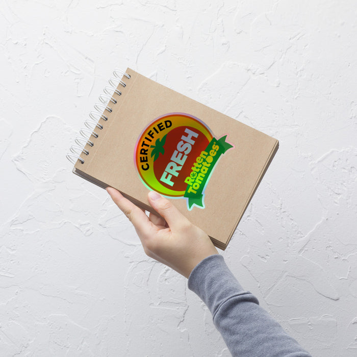 Close-up of the Rotten Tomatoes sticker highlighting the shimmering holographic texture and embossed finish