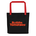 Rotten Tomatoes logo tote bag in white with red handles and the classic tomato graphic centered on the front