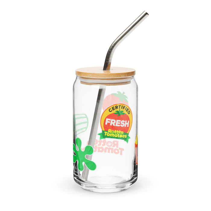 Close-up view of the Rotten Tomatoes movie review sticker icons printed clearly on the surface of the clear glass cup