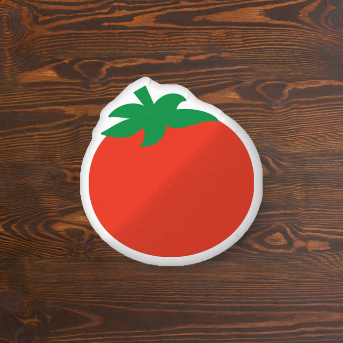 Close-up of the soft polyester fabric texture and rounded shape of the Rotten Tomatoes tomato pillow