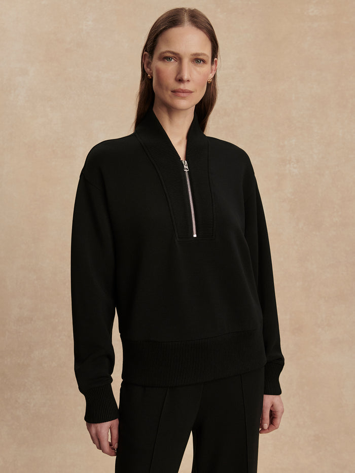 Black|Front-facing view of the Varley Sally Half Zip Sweat in Black, featuring a half-zip neckline and relaxed silhouette.