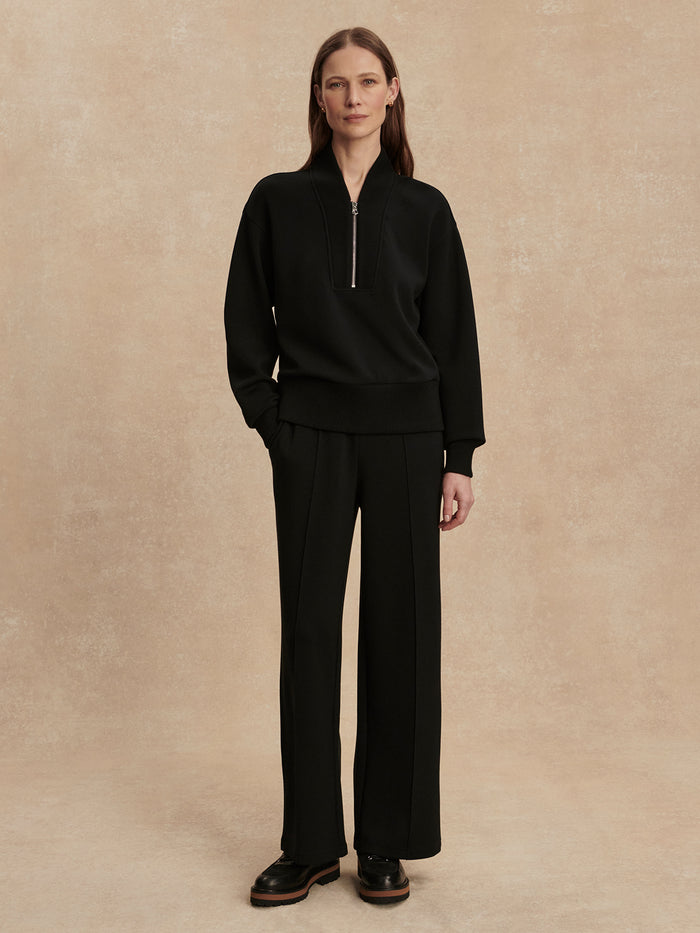 Black|Sally Half Zip Sweat in Black by Varley, front view product shot highlighting the half-zip neckline and relaxed sweatshirt silhouette.
